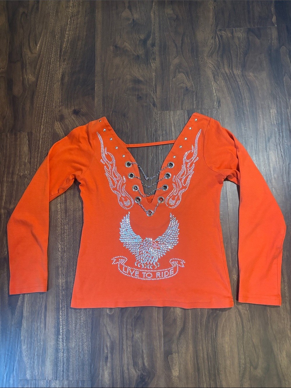 Vance Bikerwear Women’s Orange Rhinestone V-neck long sleeve with chain detail